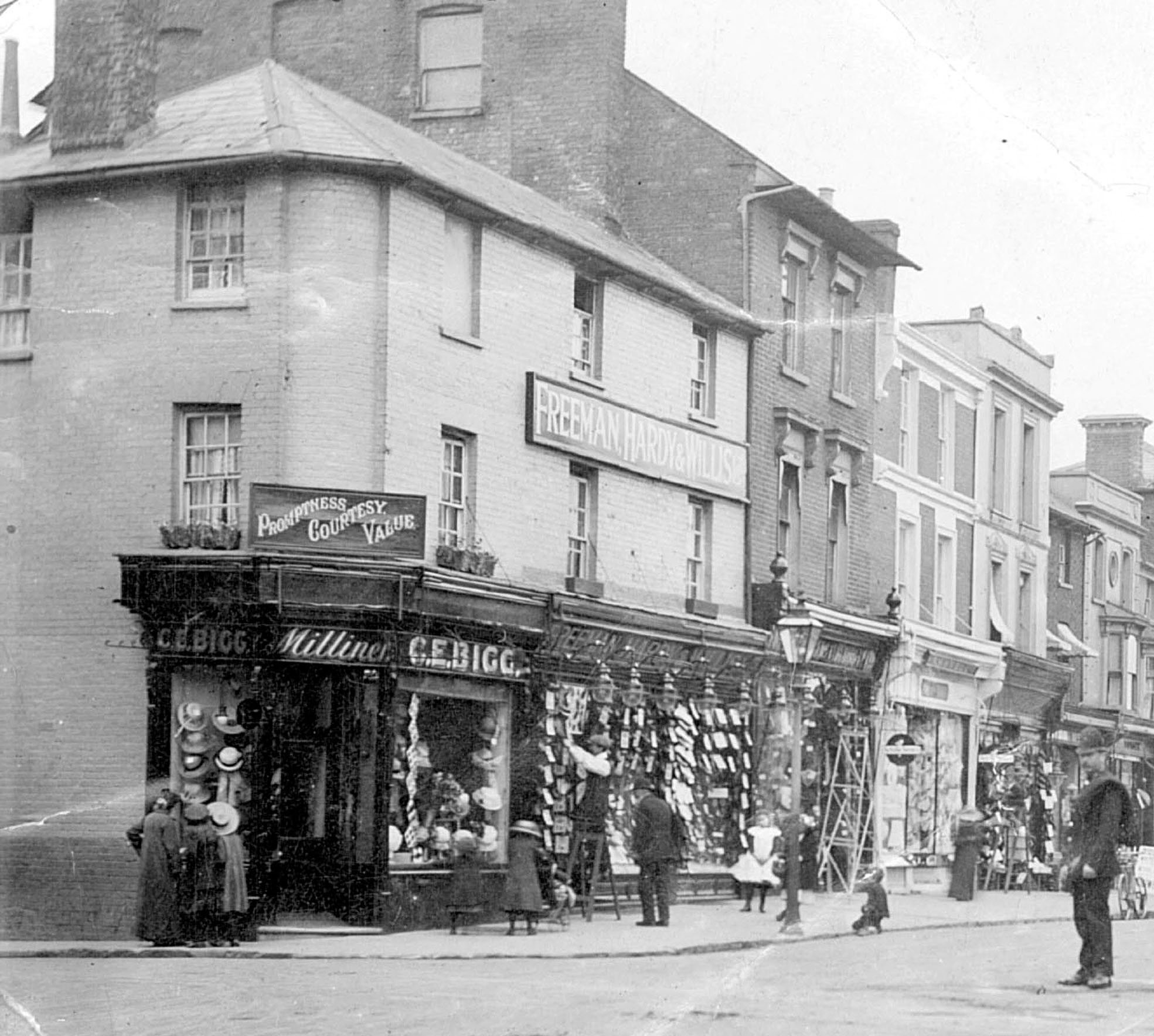 A photo showing the corner of church street with shops and people.